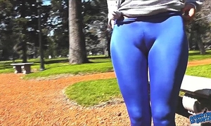 Round booty legal age teenager in ultra constricted shiny spandex showing cameltoe in public!