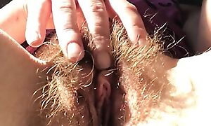 Sexy mature redhead Rachel Wriggler plays with her super bushy pussy and fingers her clit before having a bath