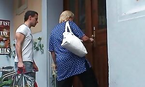 Busty blonde granny pleases young guy for help