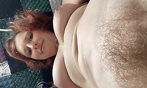 Seriously real hairy hippie Rachel Wriggler stands over her phone mid wank as she needed to change some batteries