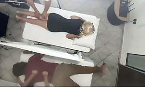 Erotic Massage on the Body of the Beautiful Wife Next to Her Husband in the Couples Massage Salon It Was Recorded